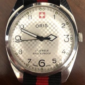 Vintage Oris manual wind watch. Nylon strap. Runs good.